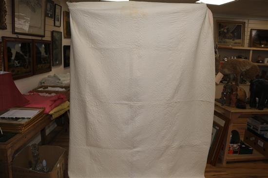A rose pink and light pink reversible quilt, another reversible with yellow, the other mint green gingham and pink (3)